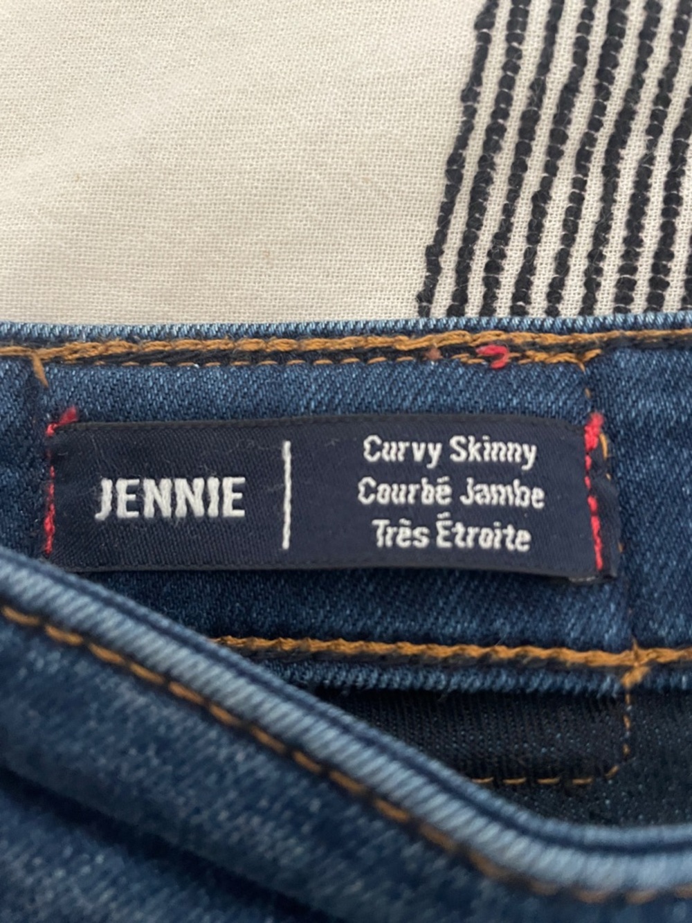Jenni Curvy Skinny Jeans in Dark Blue with Orange and Red Accents